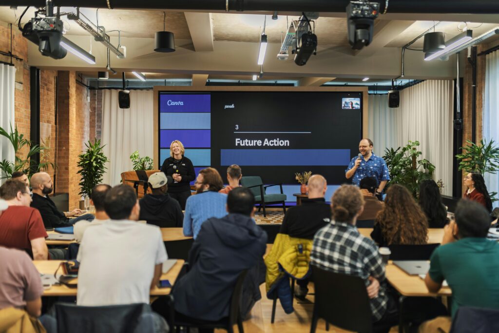 Interactive professional presentation in a modern office setting with diverse audience.